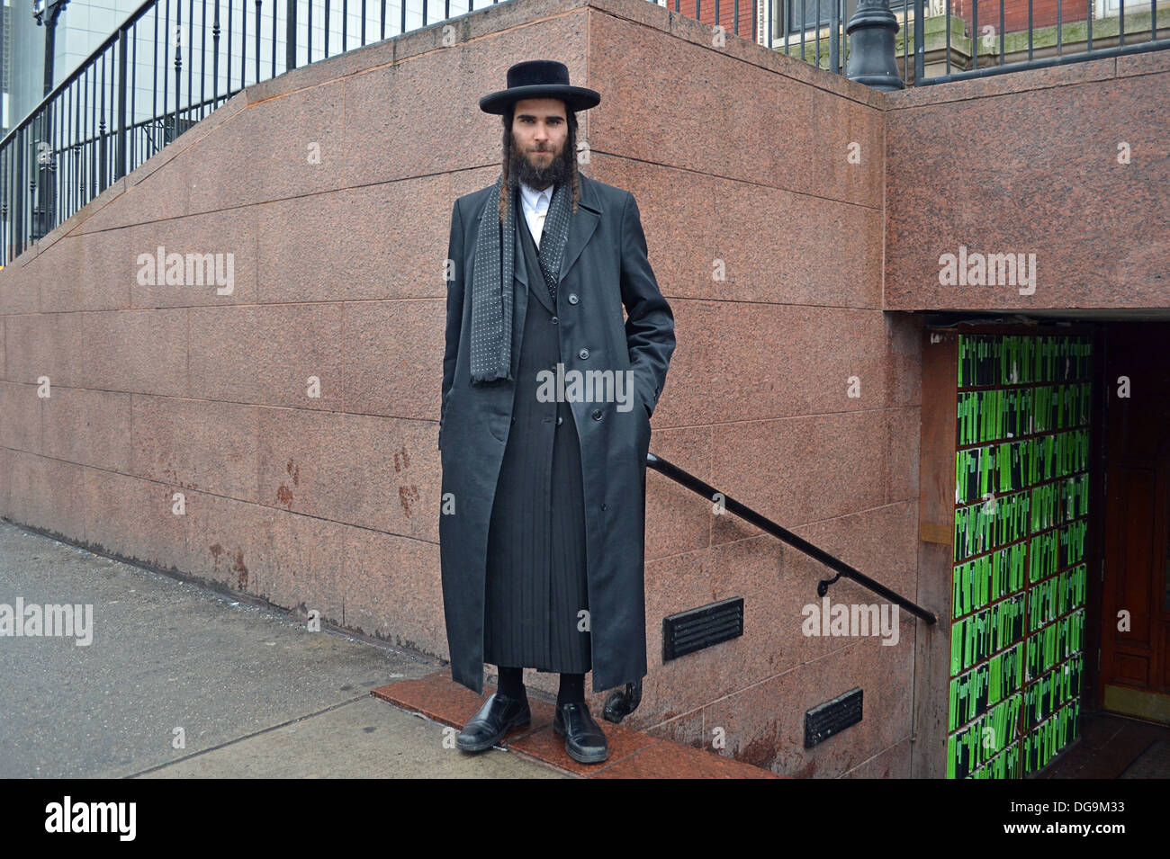 Portrait of an orthodox religious Jewish man in a black coat & hat. In Crown Heights, Brooklyn, NY at the Lubavitch synagogue. Stock Photo