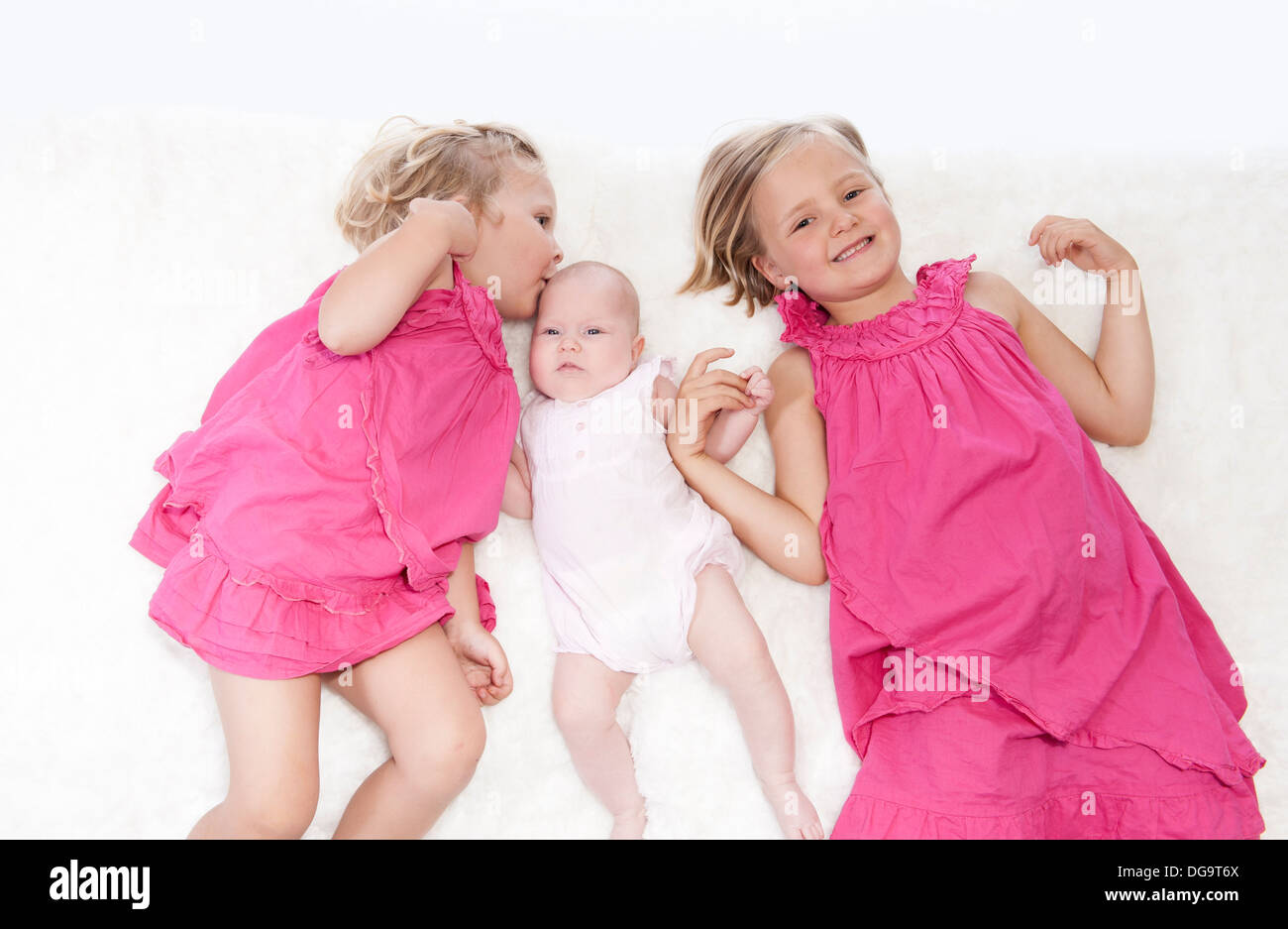 happy little girls with baby sister Stock Photo