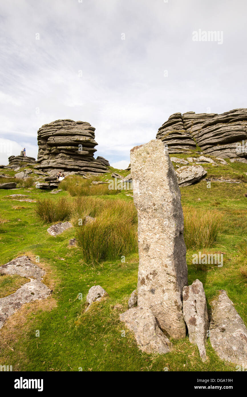 A granite Tor and standing stone on the summit of Great Links Tor, on Dartmoor, Devon, UK. Stock Photo