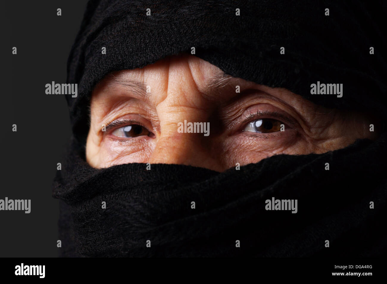 Eyes of senior muslim woman with niqab, looking at camera Stock Photo