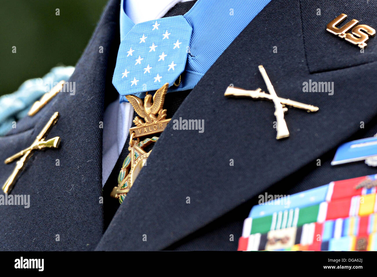 The Medal of Honor hangs from the neck of former US Army Capt. William D. Swenson as speaks to the media outside the White House after he was presented with the Medal of Honor by President Barack Obama October 15, 2013 in Washington, DC. The Medal of Honor is the nation's highest military honor. Stock Photo