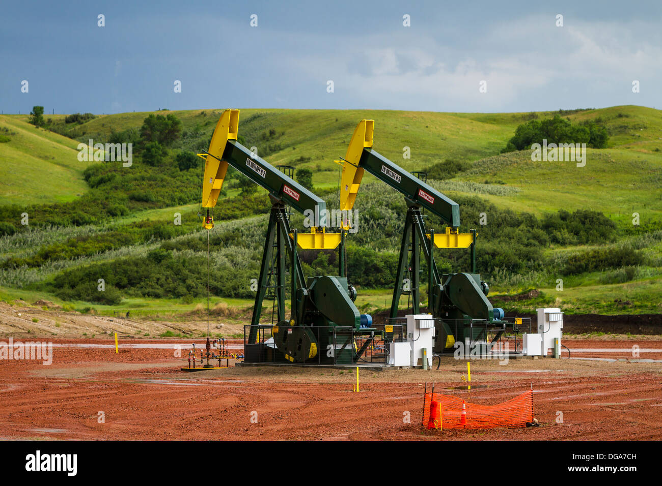 Oil pumpers in the Bakken play shale oil fields in the rolling hills