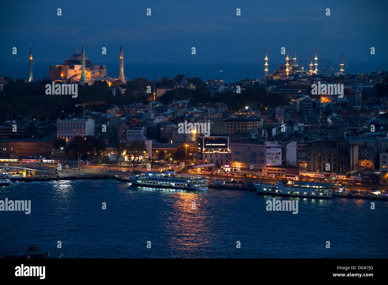Night View on Istanbul Harbour With Ships City and Mosques Stock Photo