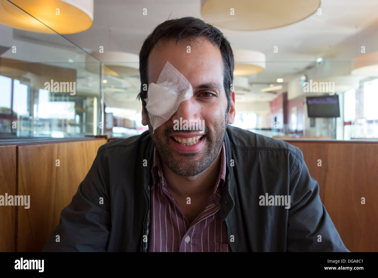 Man with eye patch over injured eye Stock Photo