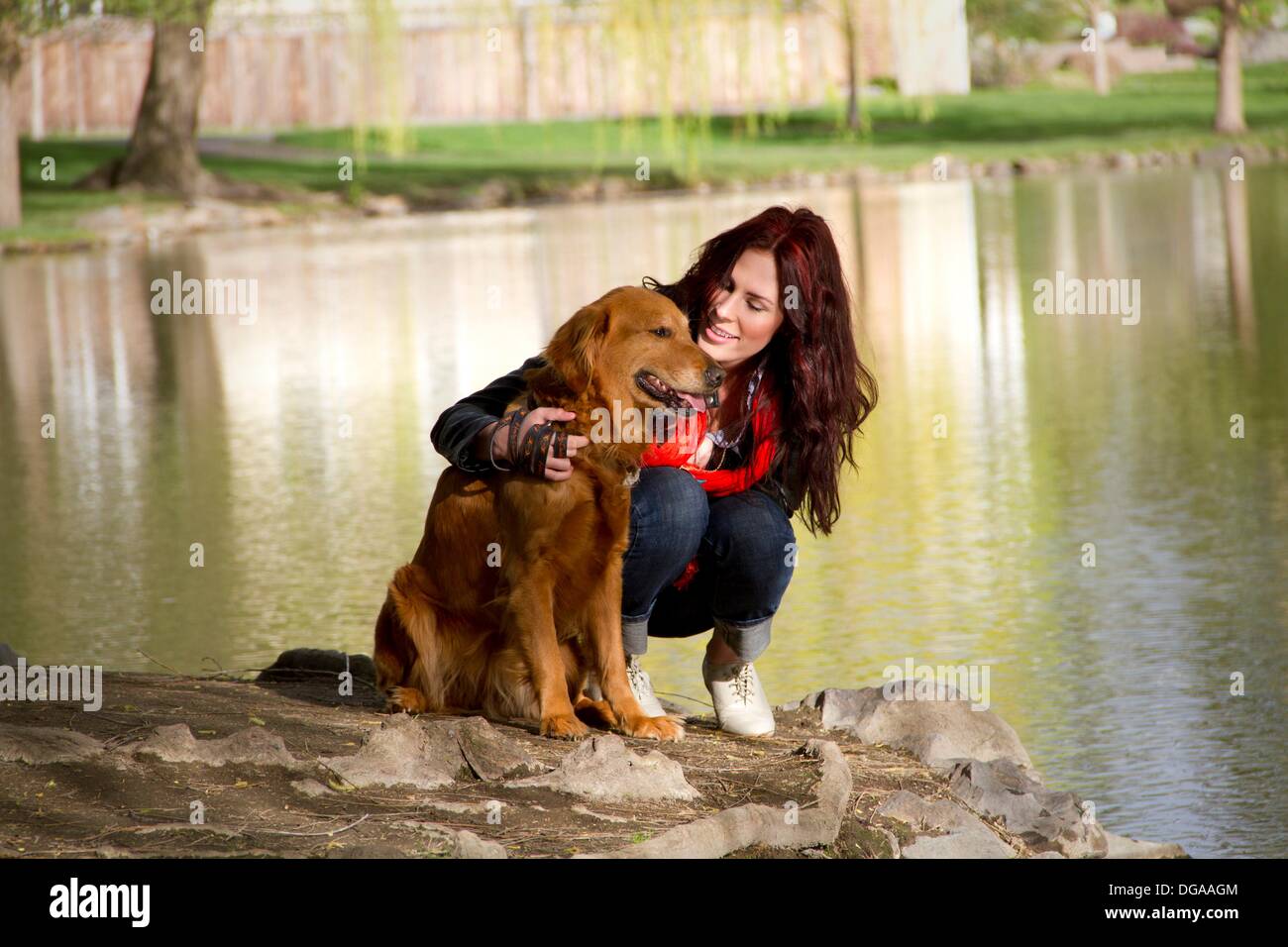 A woman outdoors with her Golden Retriever Stock Photo - Alamy