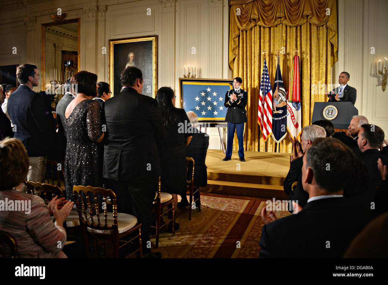 US President Barack Obama and former US Army Capt. William D. Swenson during the Medal of Honor ceremony in the East Room of the White House October 15, 2013 in Washington, DC. The Medal of Honor is the nation's highest military honor. Stock Photo