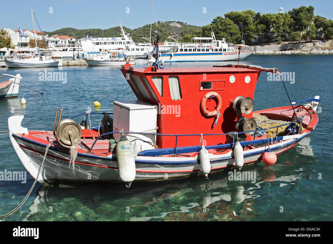 A traditional fishing boat moored in the Old Port area of Skiathos Town on the Greek Island of Skiathios in the Aegean Sea. Stock Photo