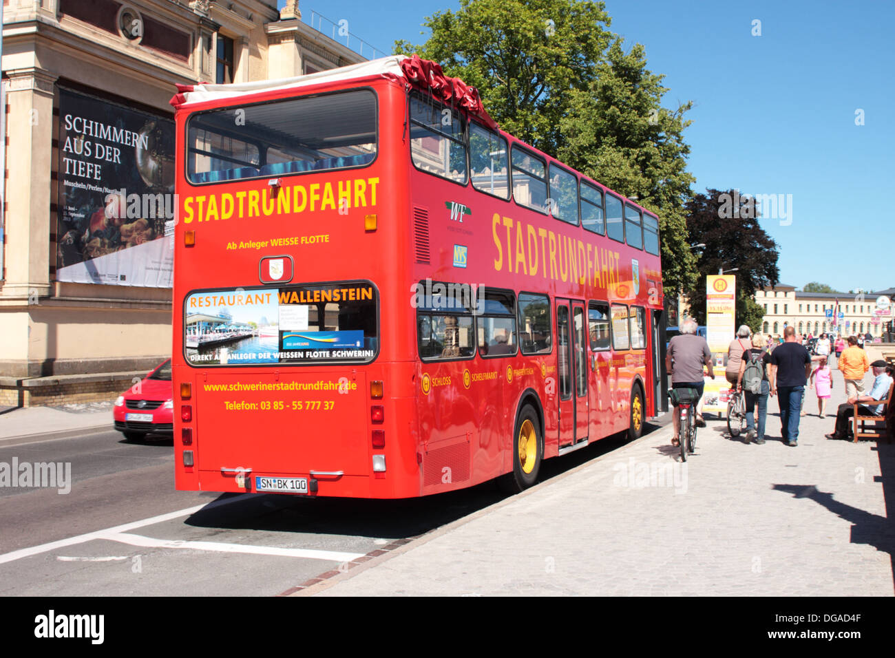 An MAN open top double deck city tour bus waiting at a stop Schwerin Germany Stock Photo