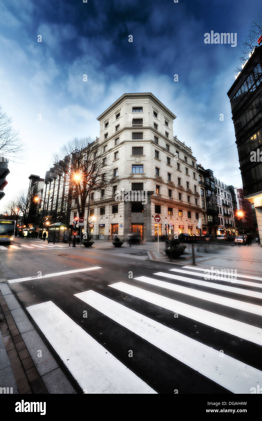 Crosswalk on the Gran Via de Bilbao in a renovated building in the background Stock Photo