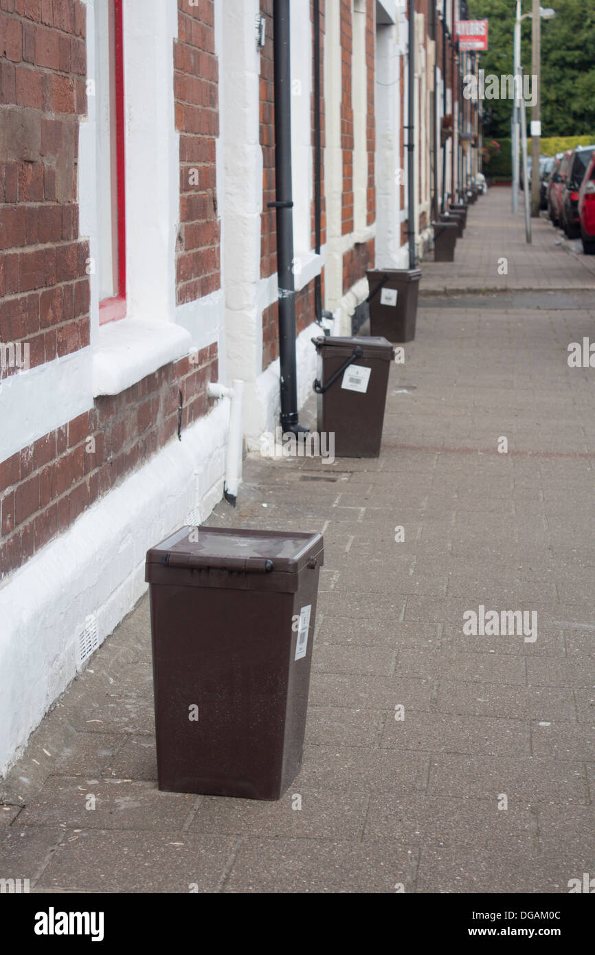 Food waste bins on street of terraced houses Cardiff Wales UK Stock