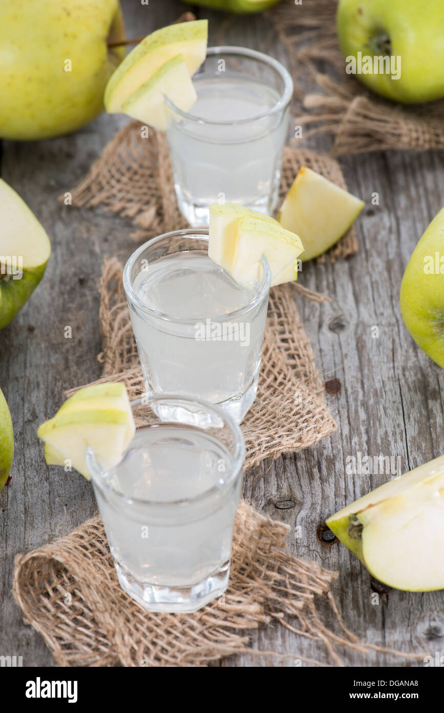 Apple Liqueur in small glasses with fruits Stock Photo Alamy