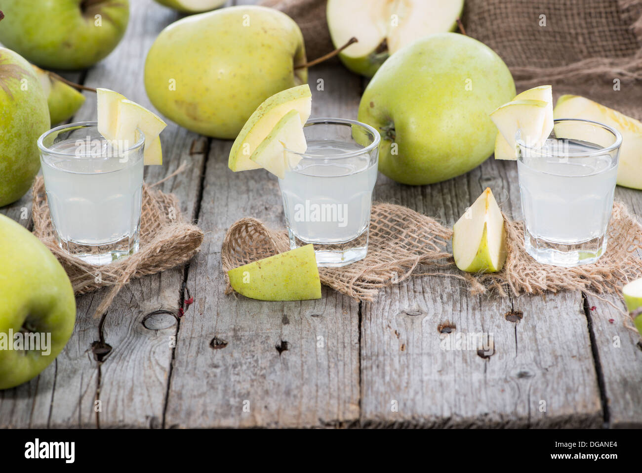 Apple Liqueur Shots on wooden background Stock Photo