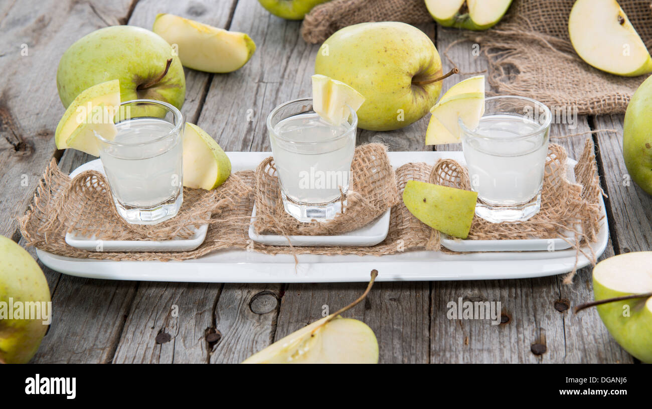 Apple Liqueur in small glasses with fruits Stock Photo Alamy