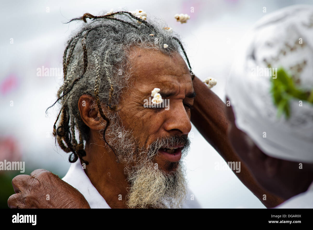 A Baiana woman performs the Afro-Brazilian spiritual cleansing ritual ...