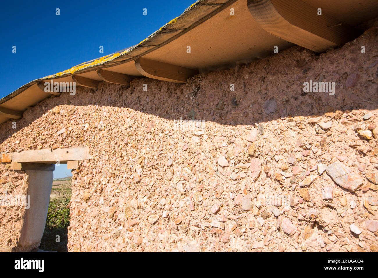 An adobe earth wall, or rammed earth wall at the Mount Pleasant Ecological Park, Porthtowan, Cornwall, UK. Stock Photo