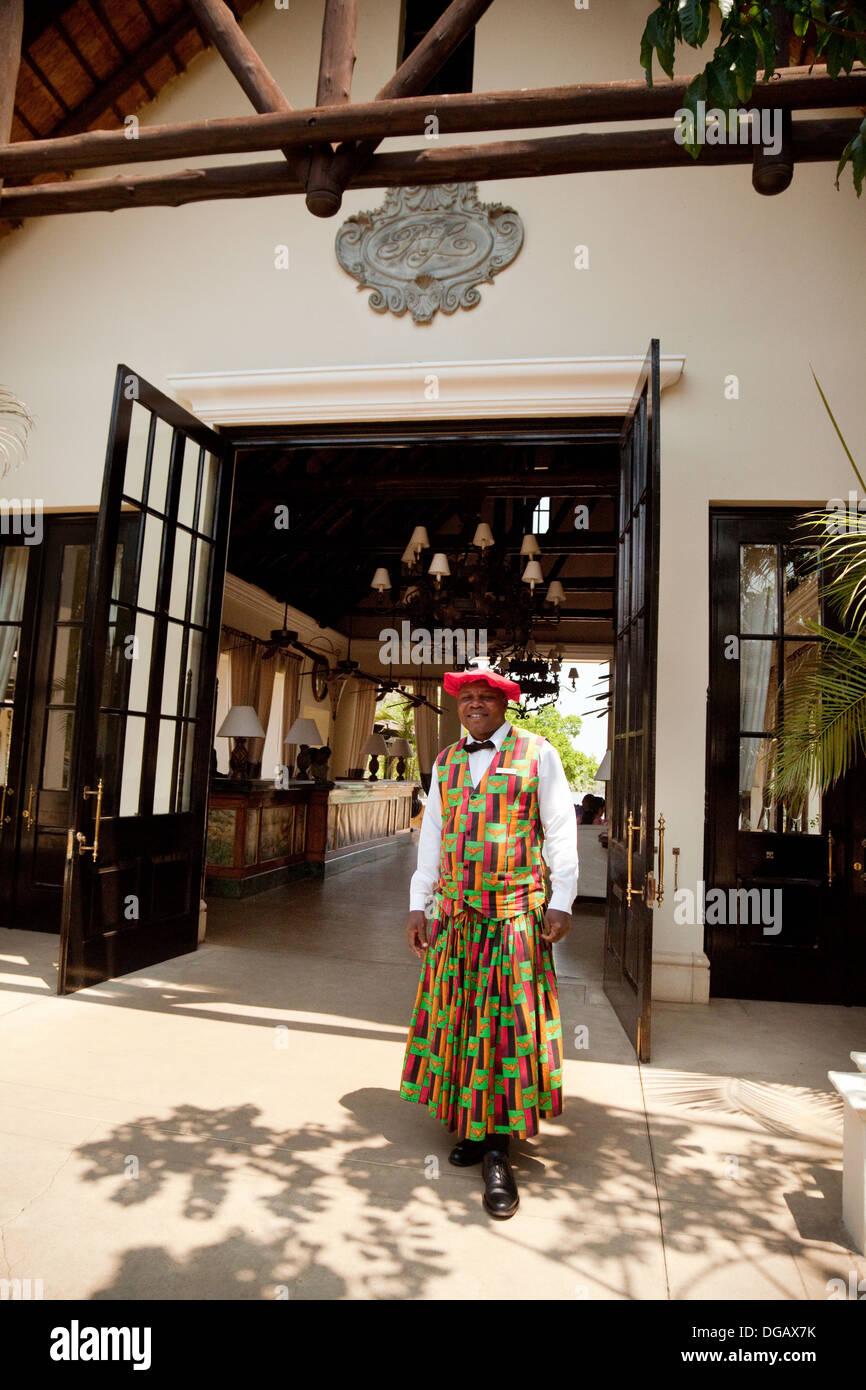 Edward, Doorman and Guest co-ordinator, wearing the costume of the Lozi tribe, Royal Livingstone luxury Hotel, Zambia, Africa Stock Photo