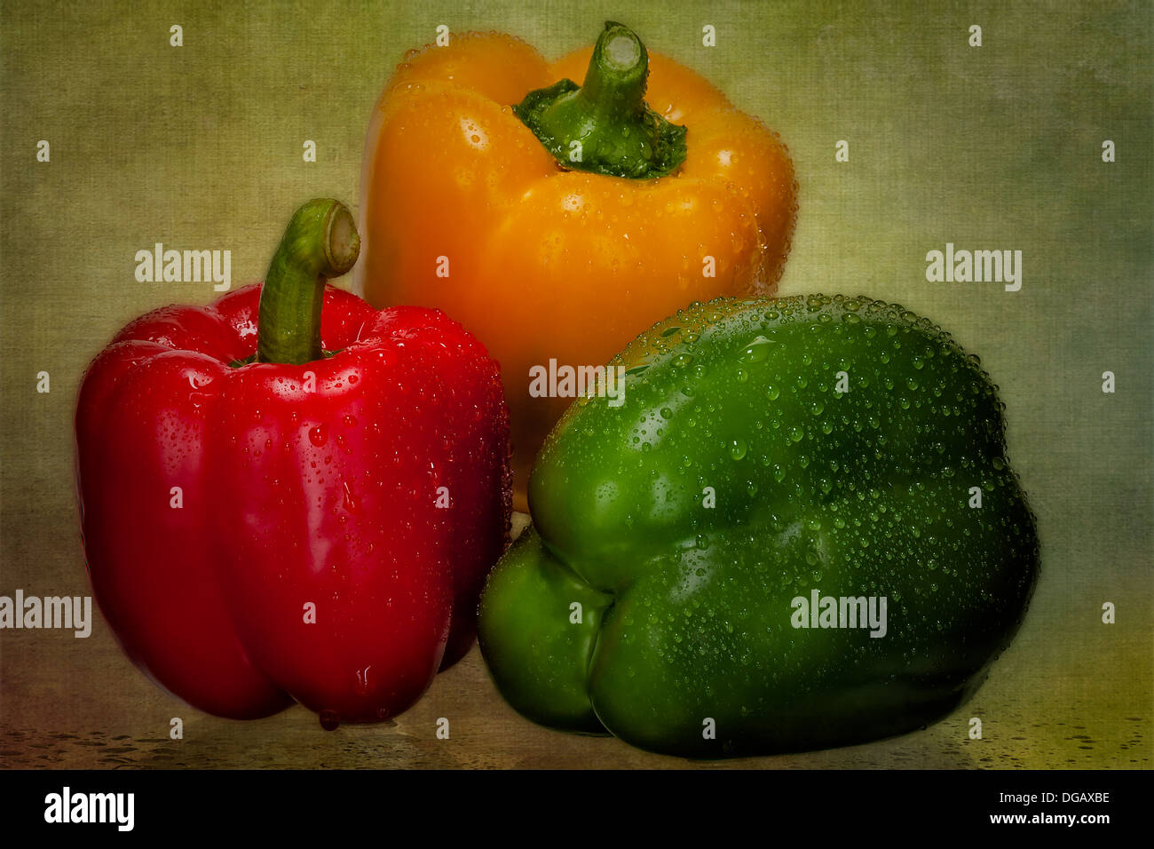Still life photograph of recently washed fresh red, green and yellow bell peppers. Stock Photo
