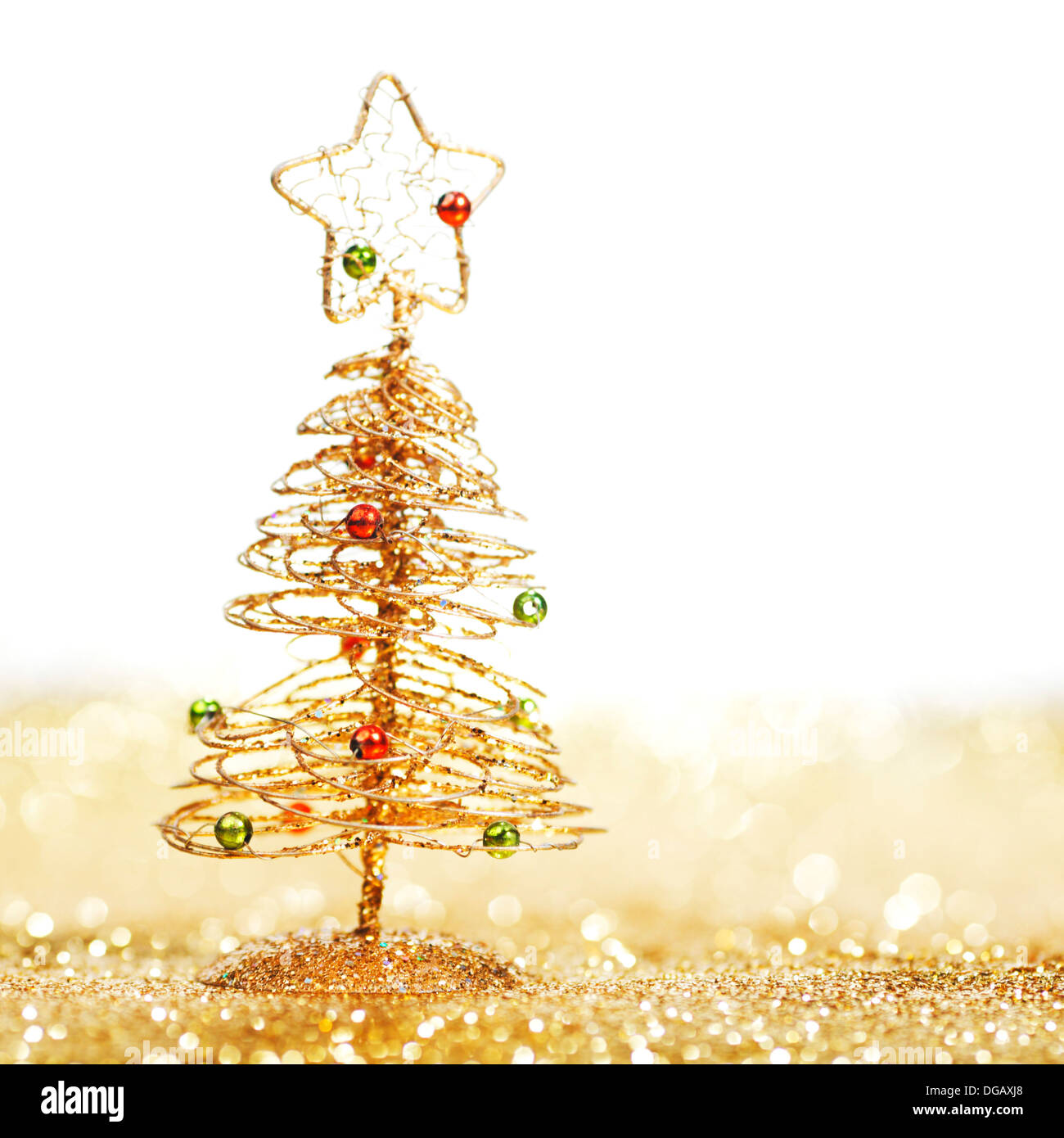 Golden christmas fir tree decoration on glitter background with white ...