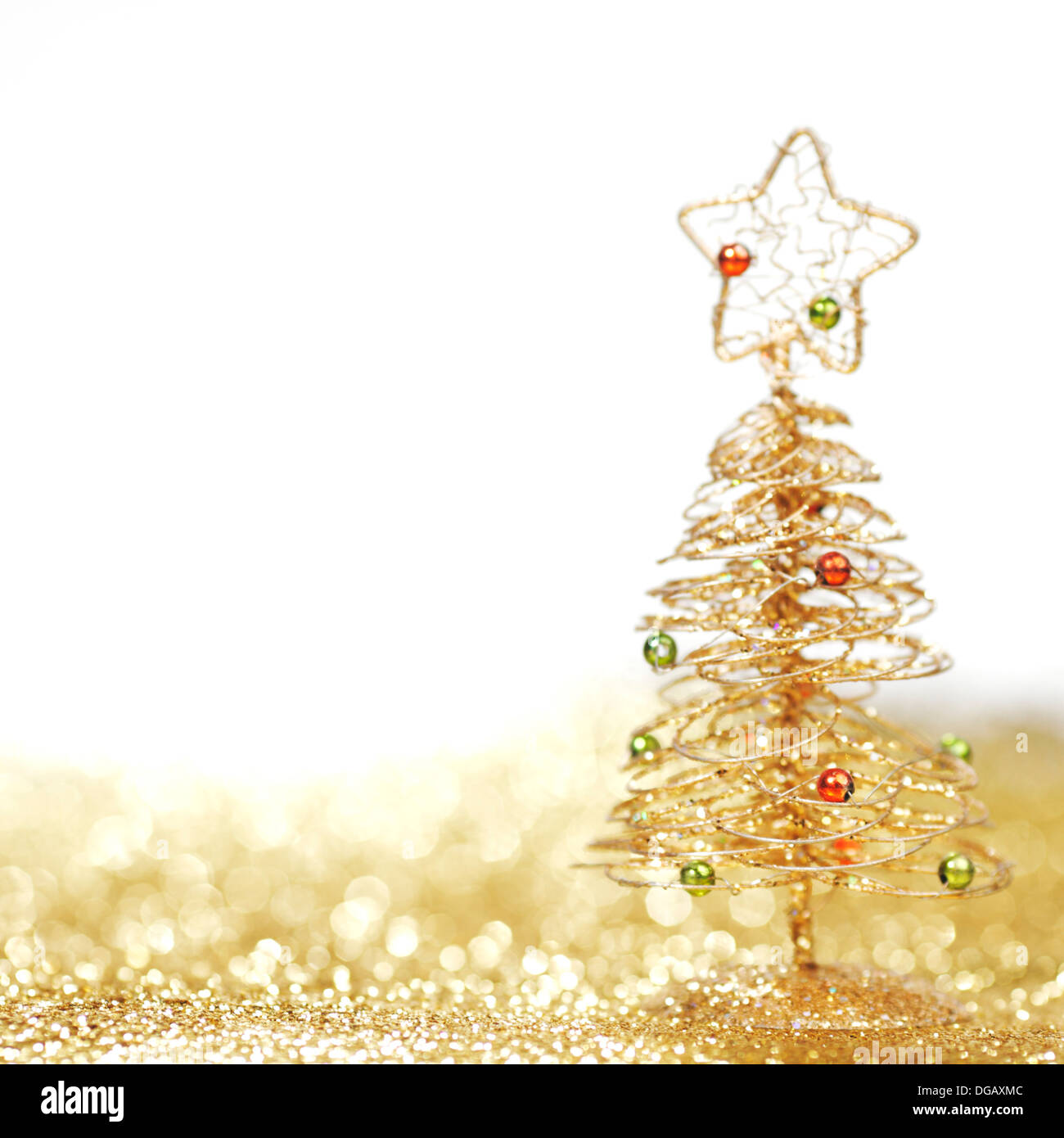 Golden christmas fir tree decoration on glitter background with white ...