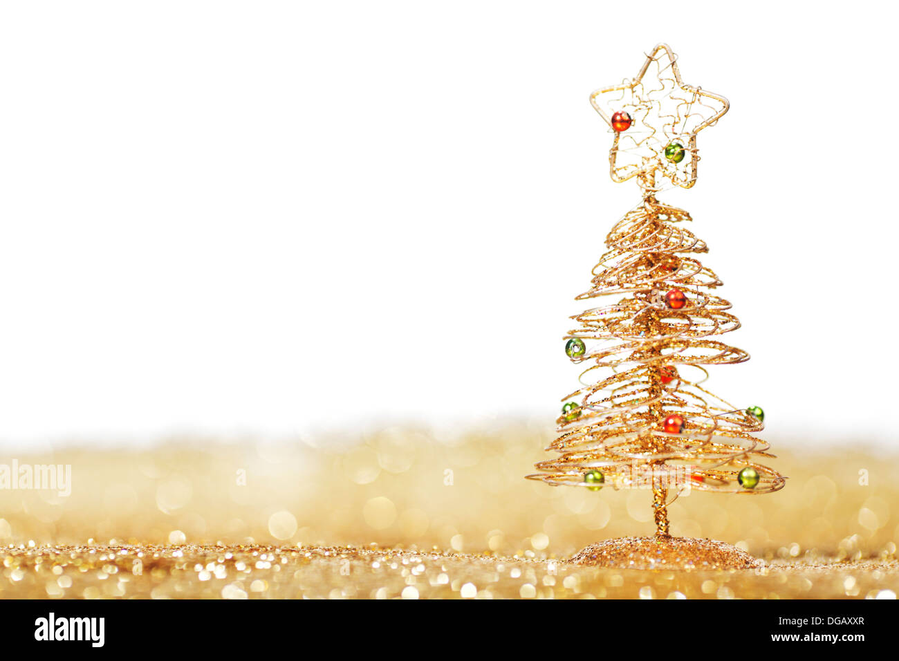 Golden christmas fir tree decoration on glitter background with white ...
