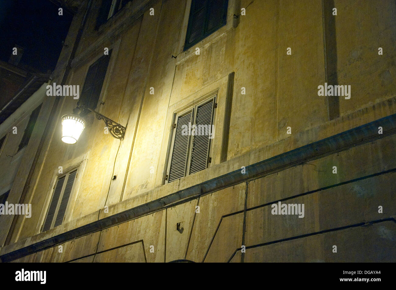 Night shot of a building facade in Rome Italy Stock Photo