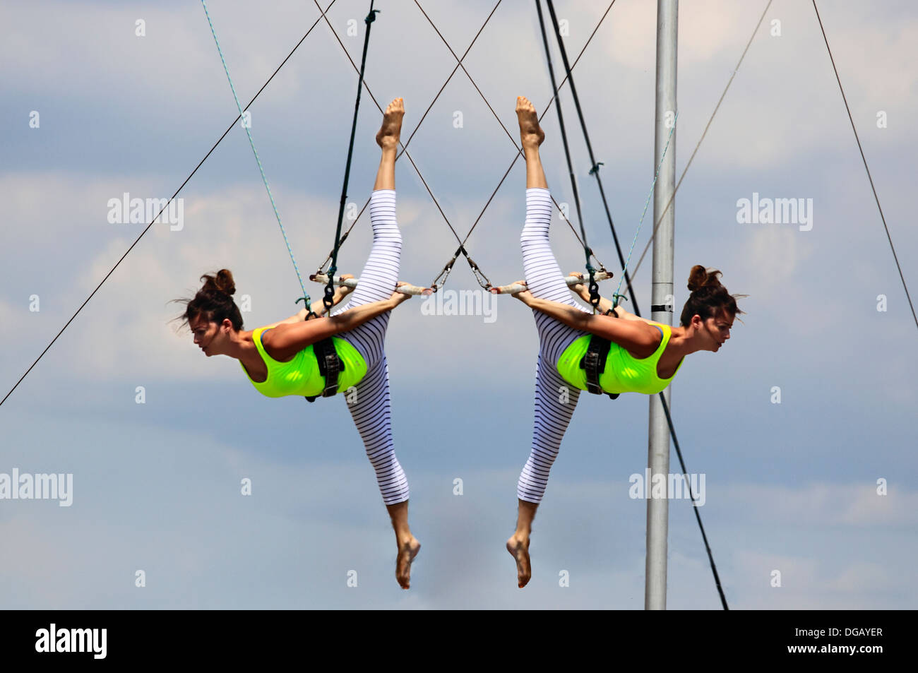 Woman practicing at trapeze school Long Beach Long Island New York Stock Photo