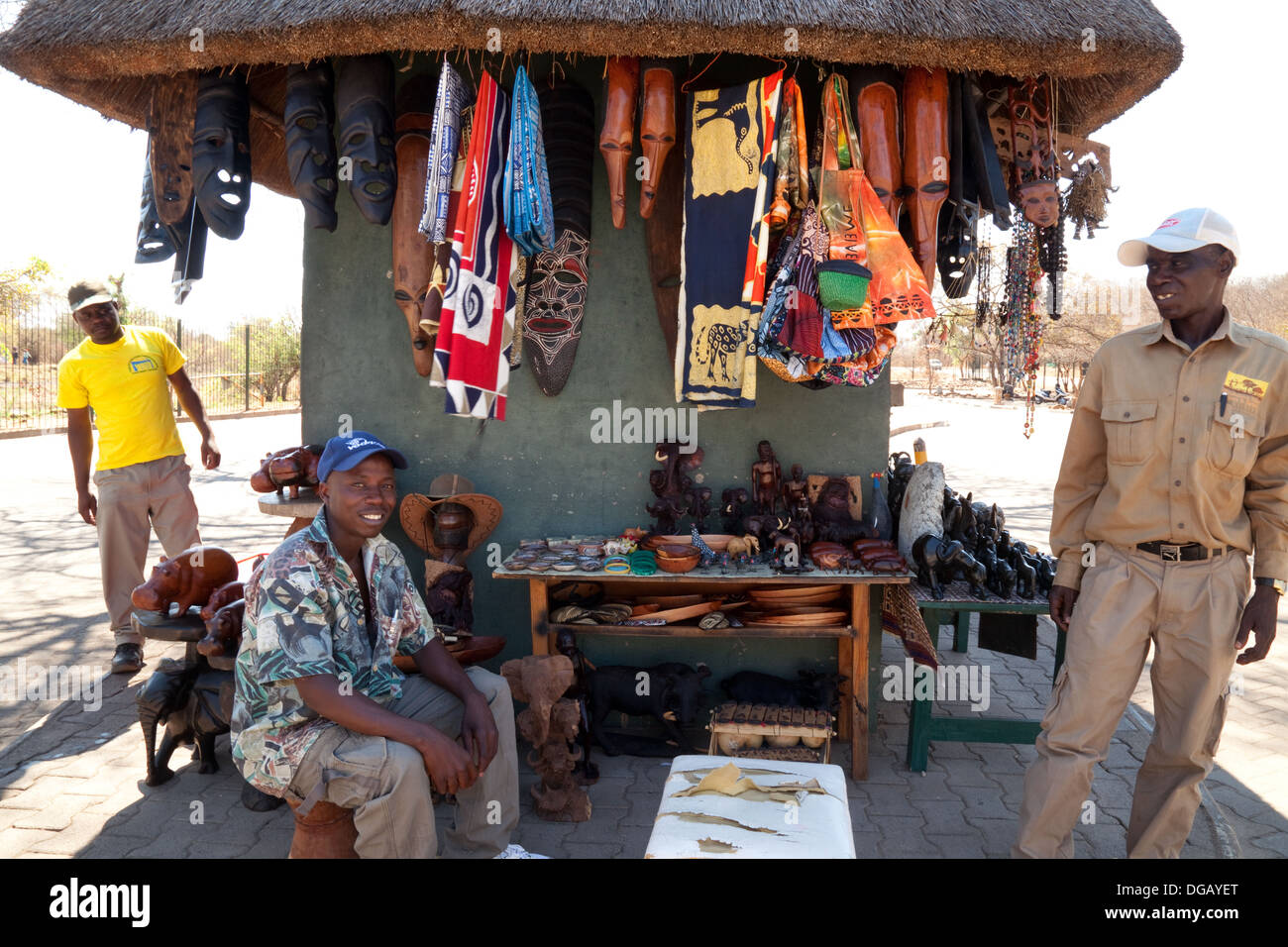 African roadside curios craft stall and stallholders, Zimbabwe, Africa Stock Photo