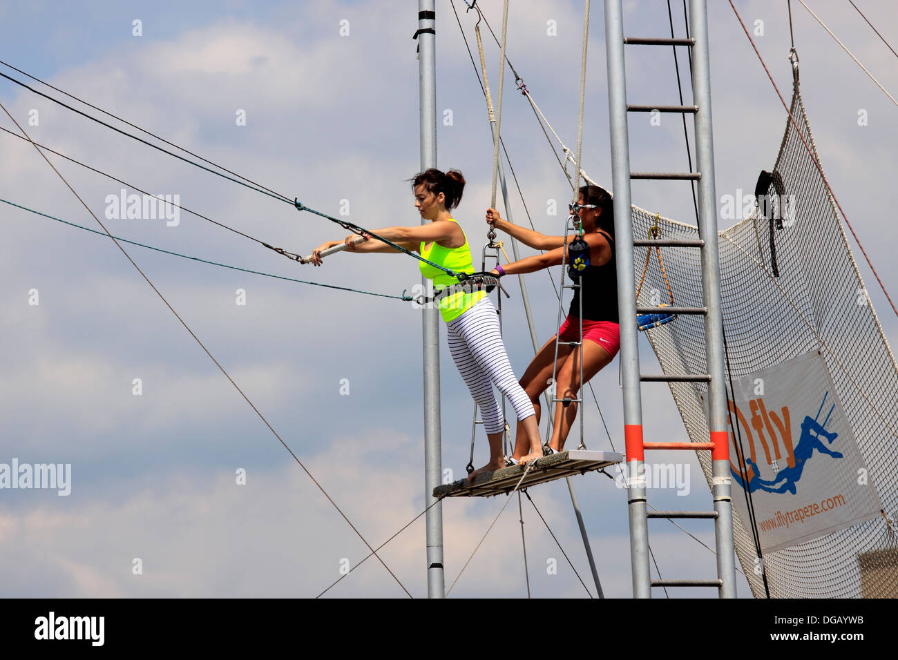 Woman practicing at trapeze school Long Beach Long Island New York Stock Photo