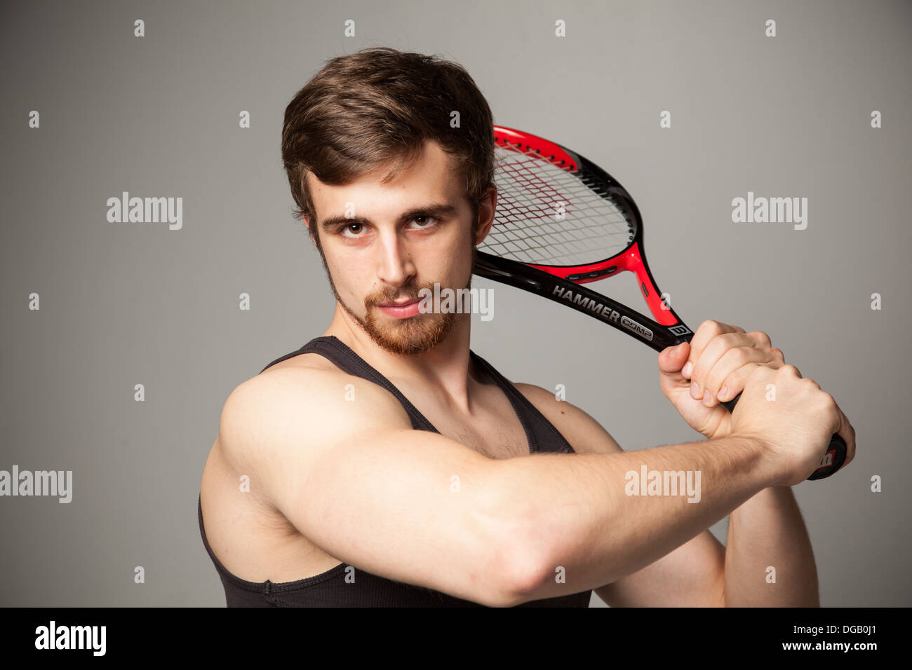 Fit male tennis player model Stock Photo - Alamy