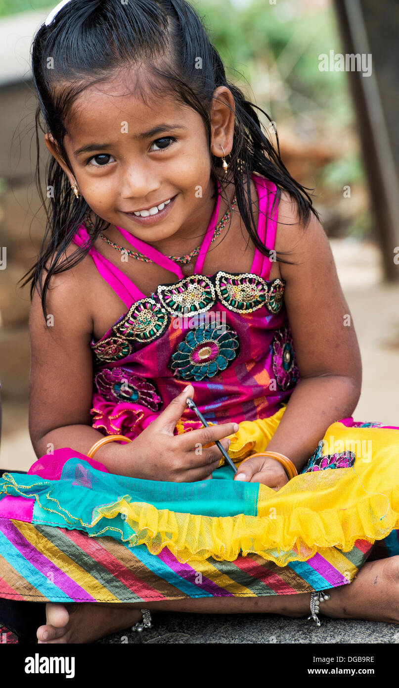 Colourful smiling Indian girl in a rural indian village. Andhra Pradesh, India Stock Photo