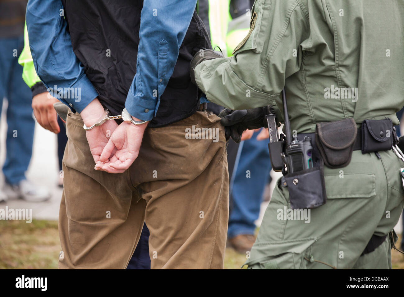 Man detained, placed under arrest and in handcuffs by police - Washington, DC USA Stock Photo