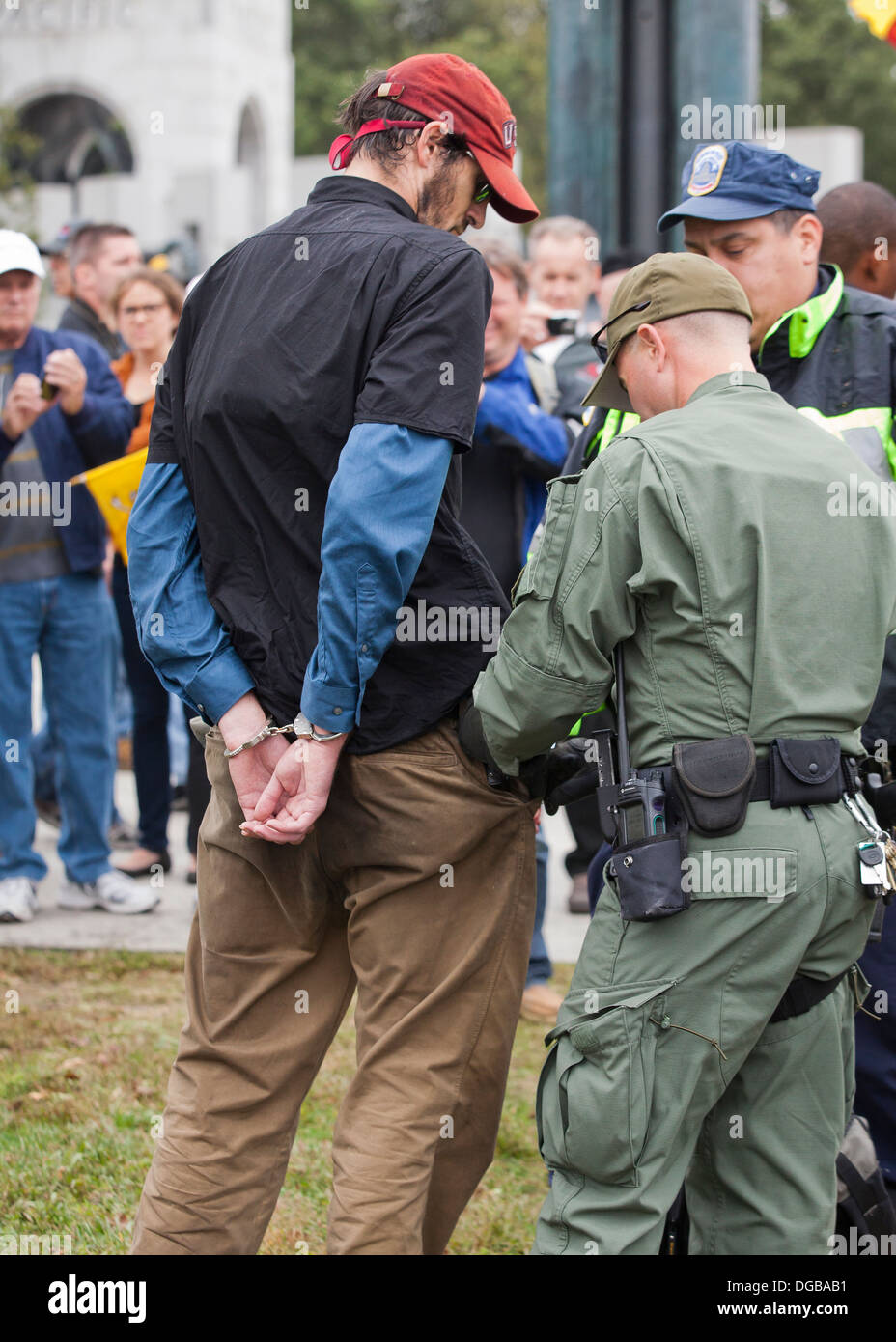 Man detained, placed under arrest and in handcuffs by police - Washington, DC USA Stock Photo