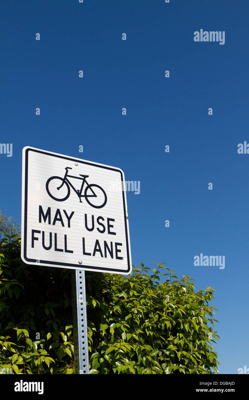 Road sign informing cyclist that they may use the full lane and not