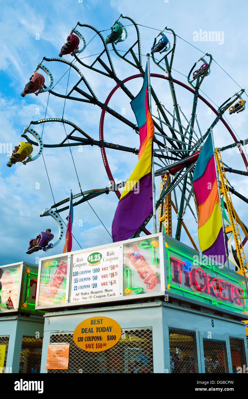 A carnival ticket booth and Farris Wheel ride in action at the Mountain