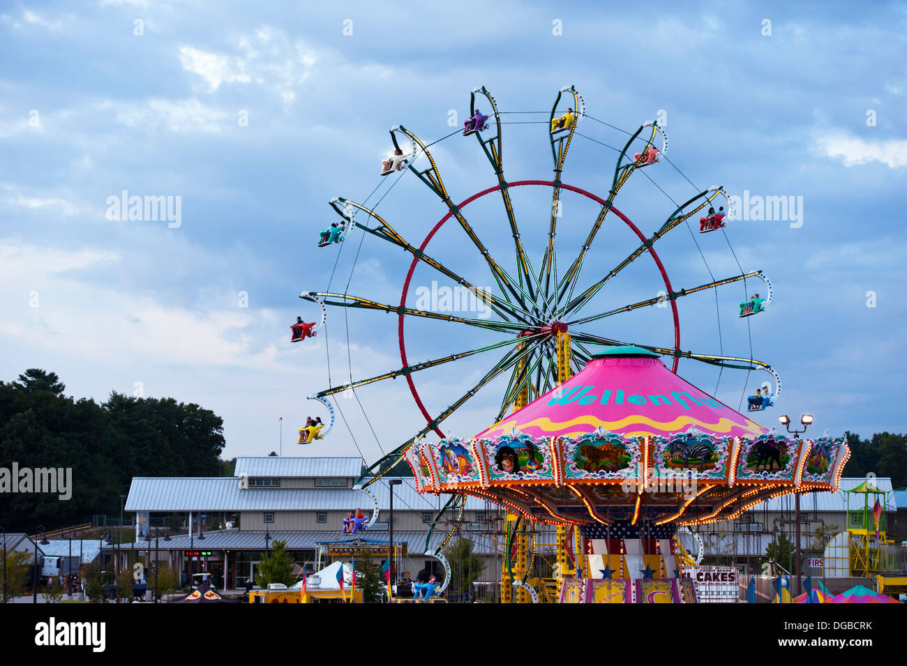 A carnival ride / Farris Wheel in action at the Mountain State Fair in