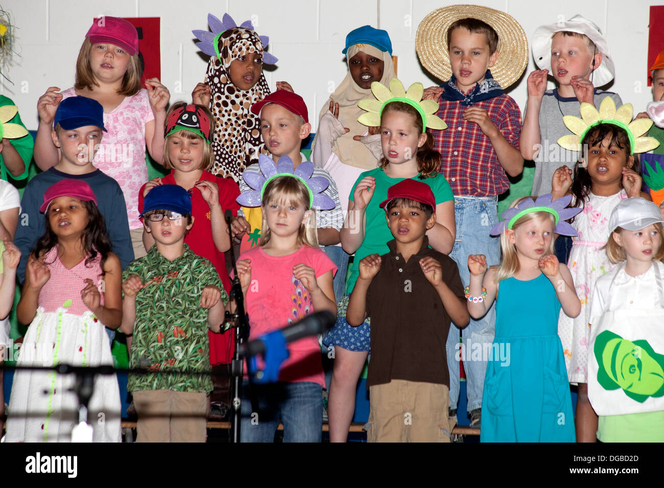 Students age 8 Muslim, Black and white singing in Spring Garden Musical. Horace Mann Elementary School St Paul Minnesota MN USA Stock Photo