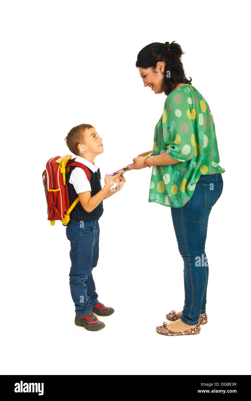 Mother prepare boy for school and giving him notebooks Stock Photo