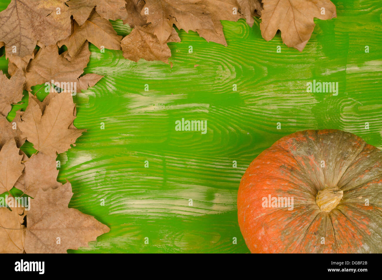 Fall background with dry leaves and a pumpkin Stock Photo - Alamy
