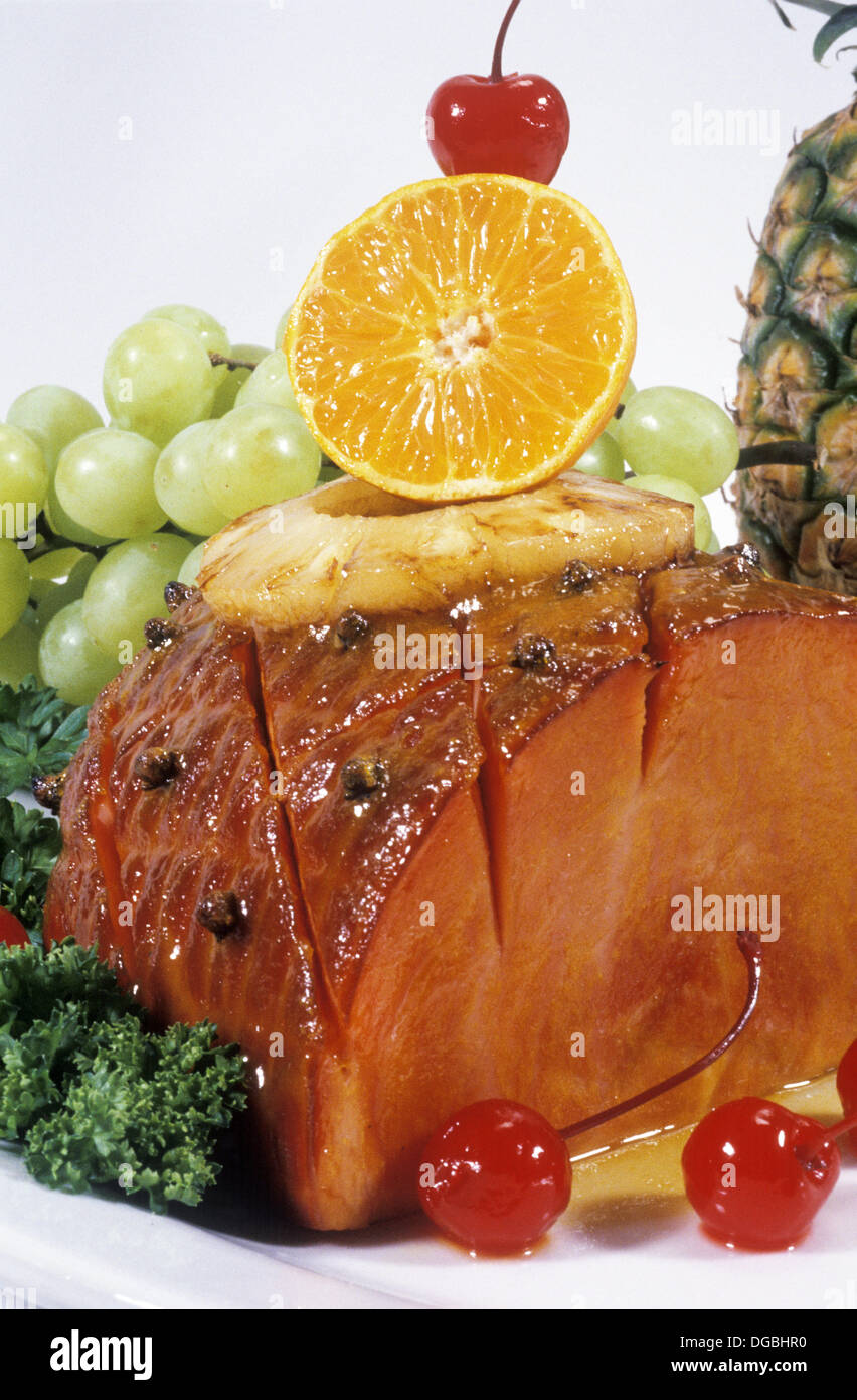 Baked ham garnished with fruit Stock Photo Alamy