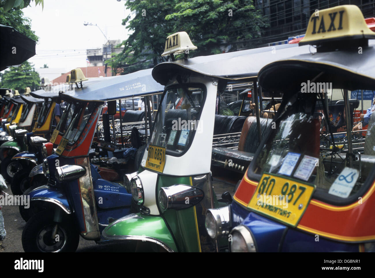 Tuk-Tuk Taxis waiting for customers at the road side, Bangkok, Thailand, Asia Stock Photo