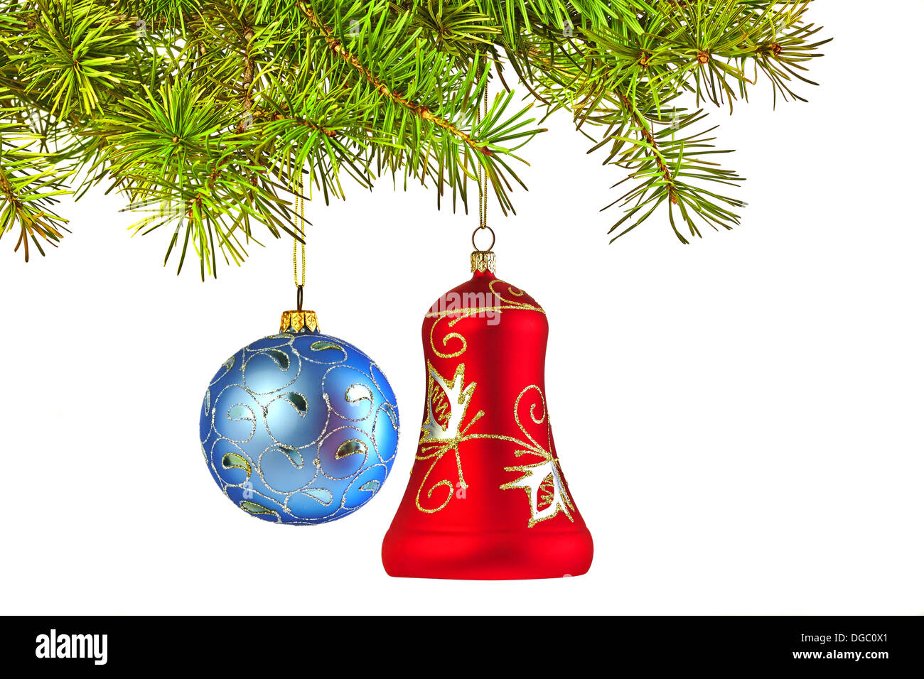 Christmas decoration-glass red bell and blue ball on fir branche Stock Photo