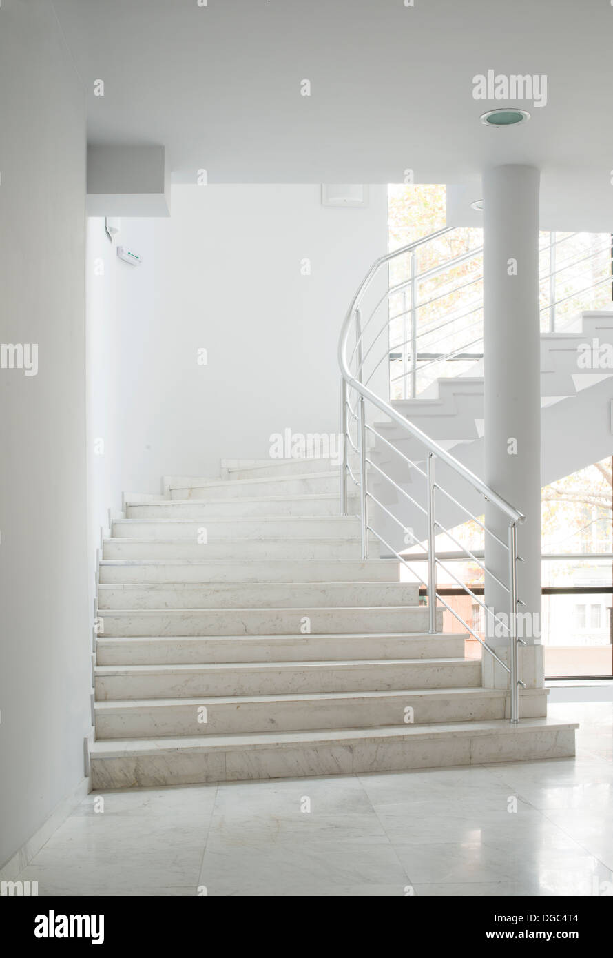 Interior of a building with white color walls. Flight of stairs Stock Photo