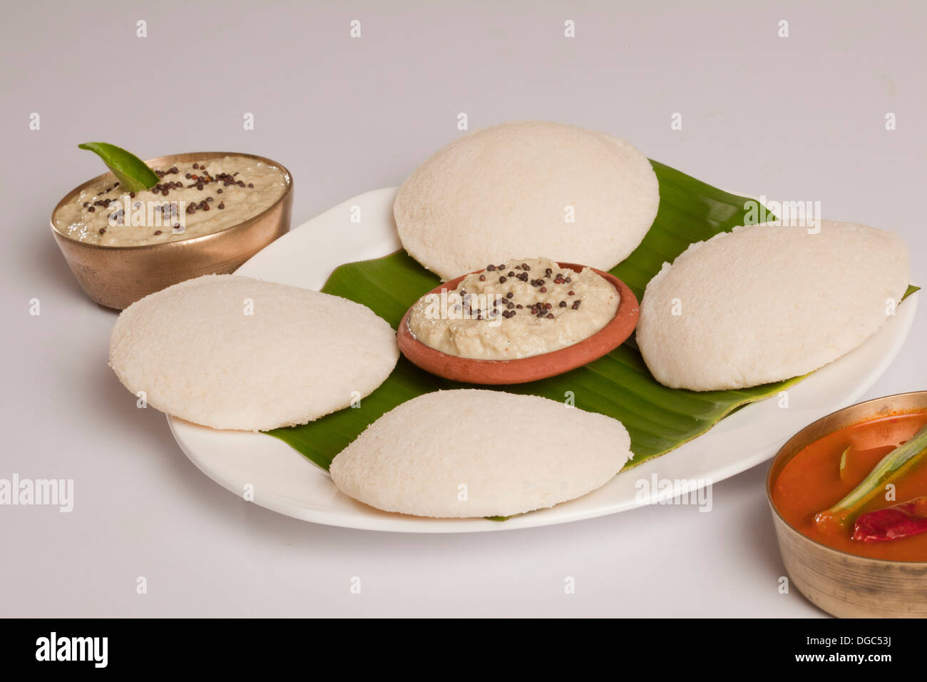 Idli is a South Indian breakfast dish served on banana leaf Stock Photo