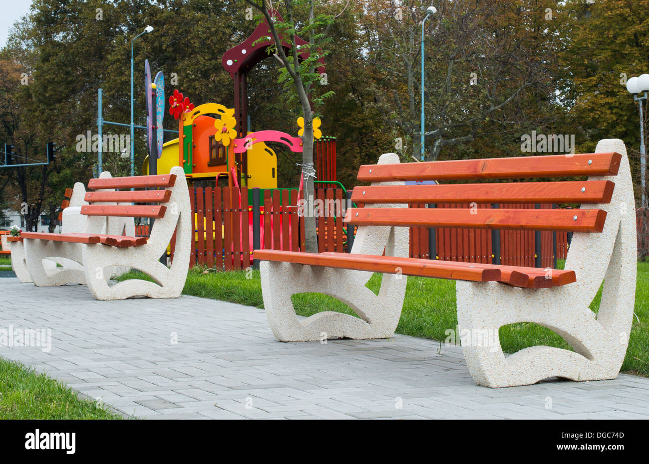 New wooden benches in a park Stock Photo