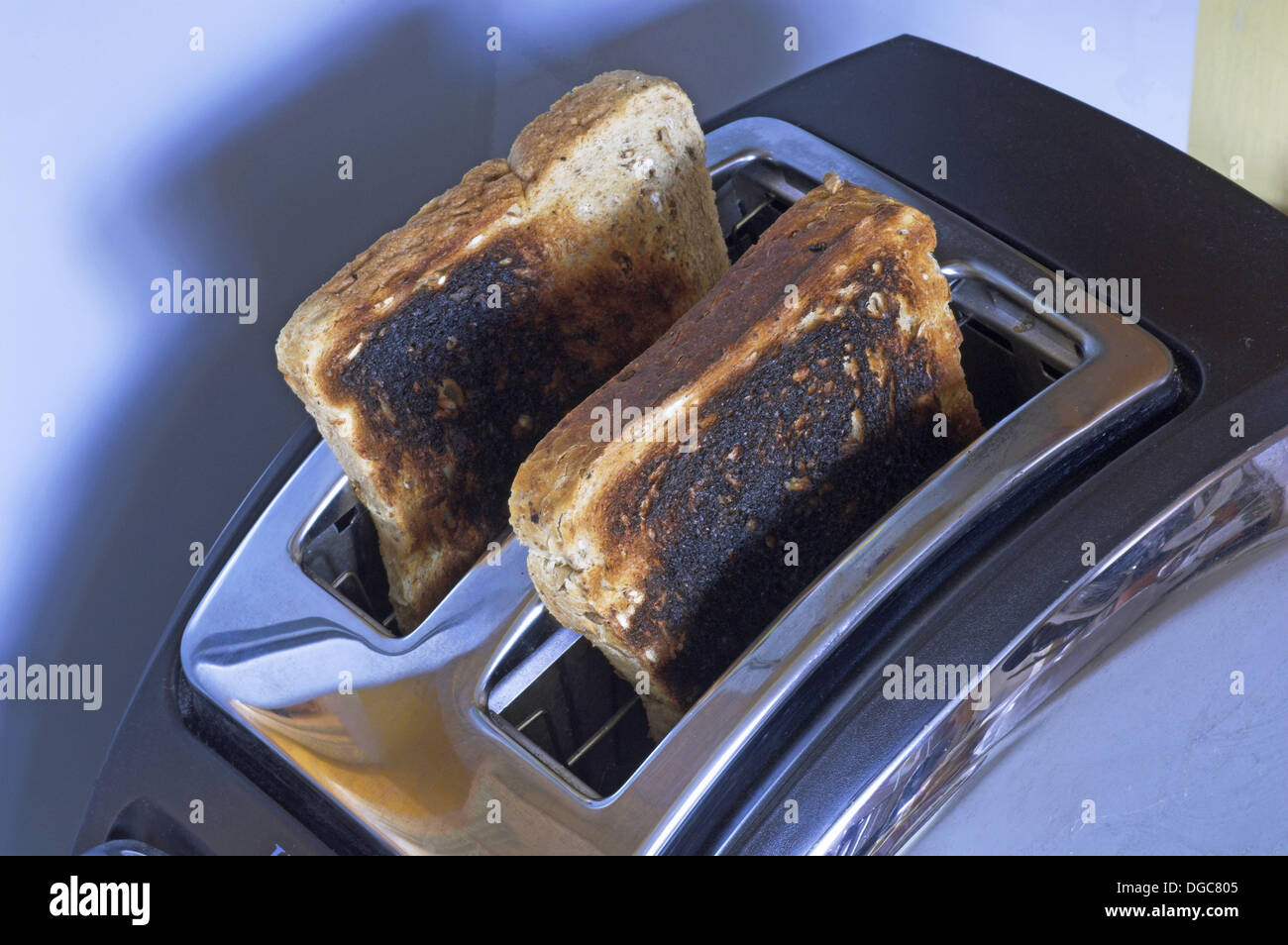 Burnt toast in toaster burned Stock Photo Alamy