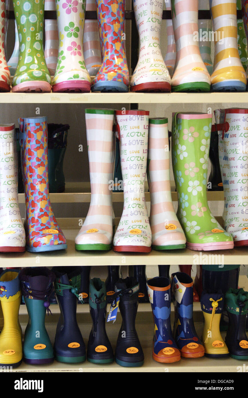 Rubber boots on display before a shop Stock Photo - Alamy