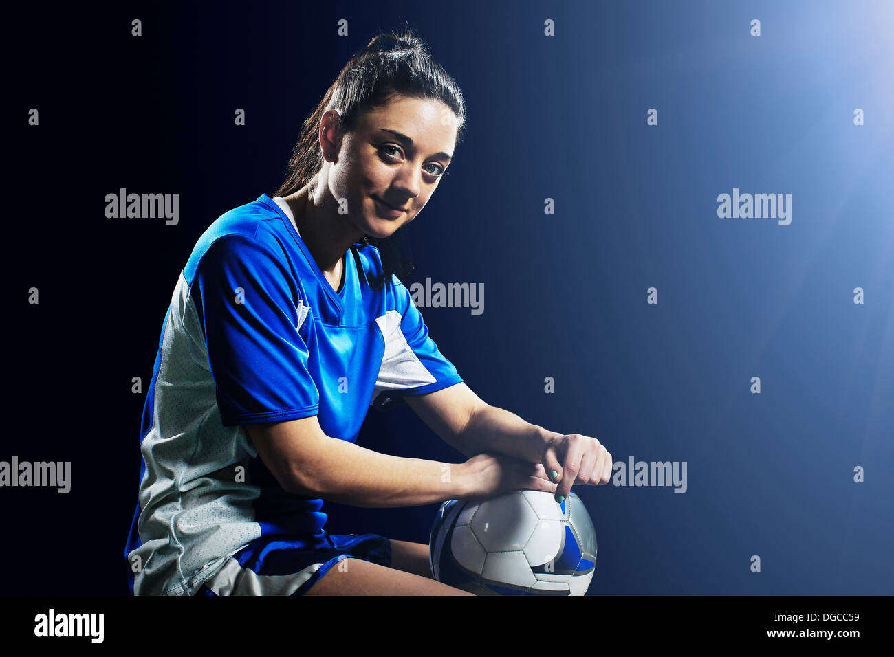 Studio shot of female soccer player Stock Photo