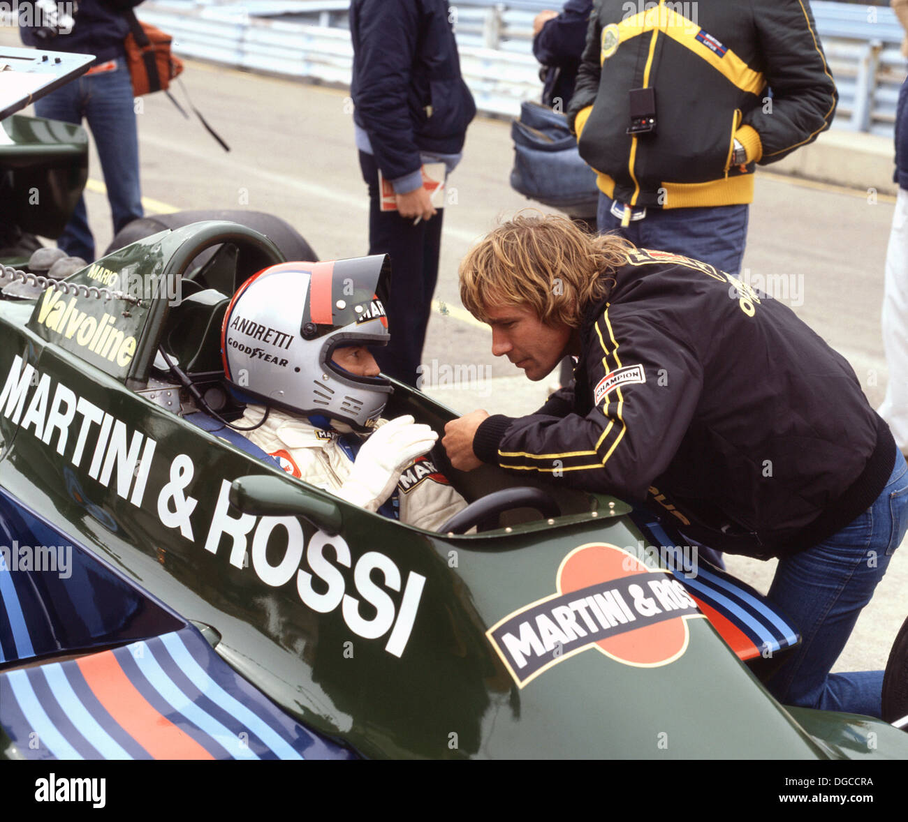 James Hunt, British racing driver who won the Formula 1 World Championship in 1976. Talking to Mario Andretti 1979. Stock Photo