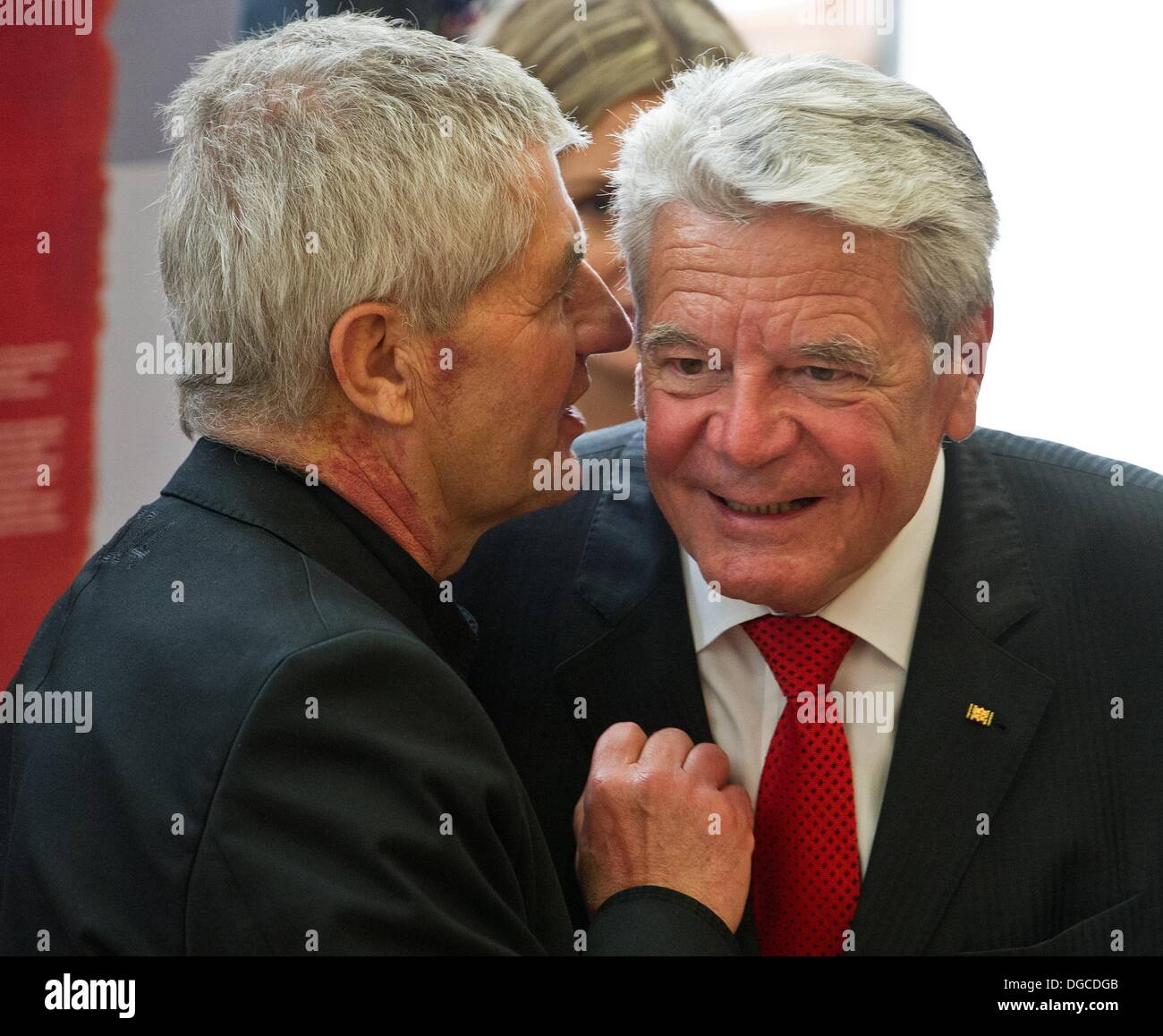 Frankfurt Oder, Germany. 18th Oct, 2013. German President Joachim Gauck (R) greets Federal Commissioner for the Stasi Archives Roland Jahn (L) in the exhibition 'Learn Polish' at at Viadrina European University in Frankfurt Oder, Germany, 18 October 2013. Both presidents opened the academic year during a visit to the Viadrina European University and the Collegium Polonicum. Photo: Patrick Pleul/dpa/Alamy Live News Stock Photo
