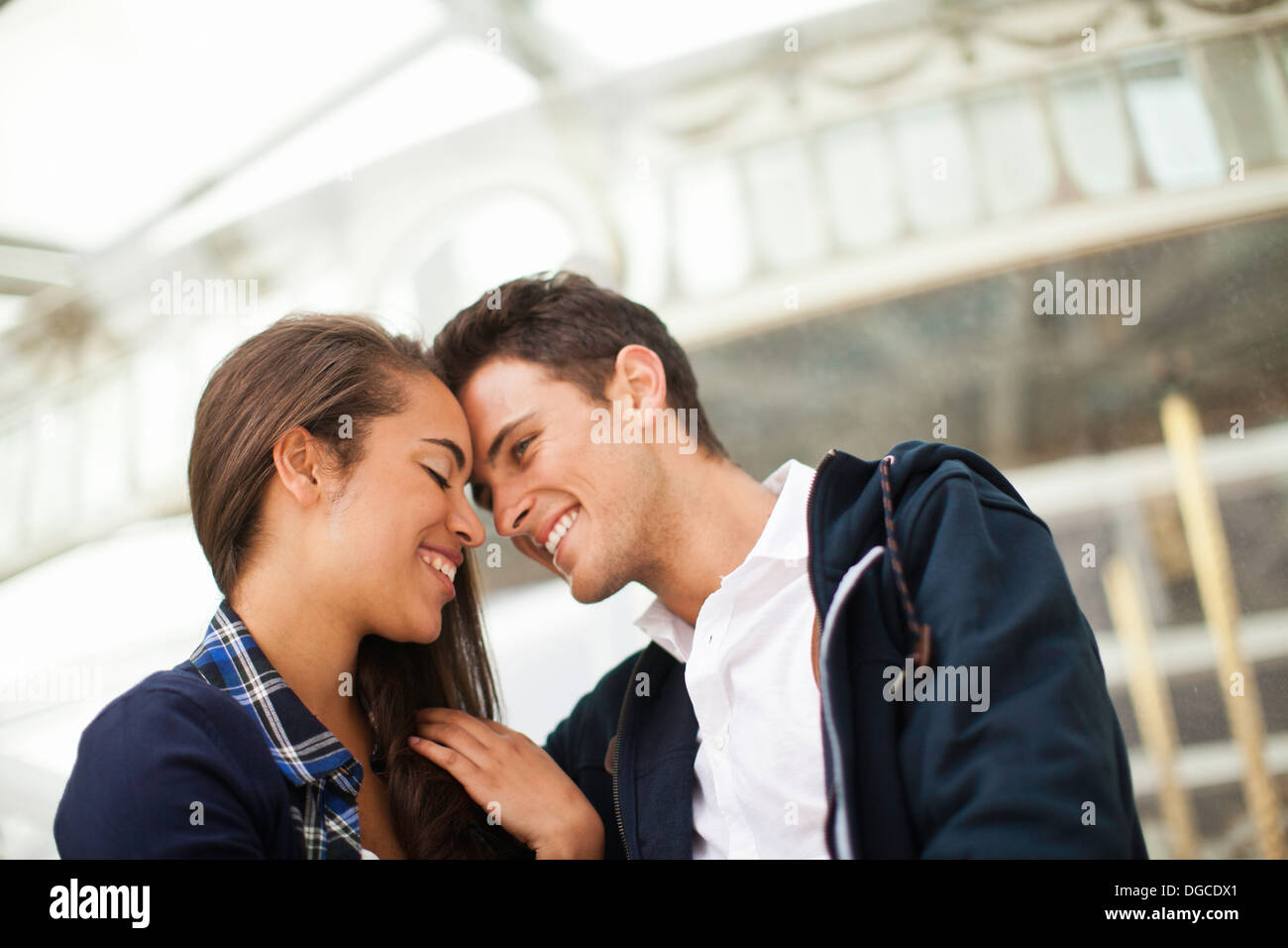 Young couple face to face, smiling Stock Photo